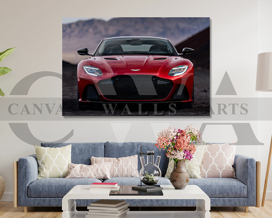 Red sports car on a wall art print above a living room with a sofa and decor.