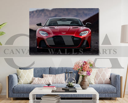 Red sports car on a wall art print above a living room with a sofa and decor.